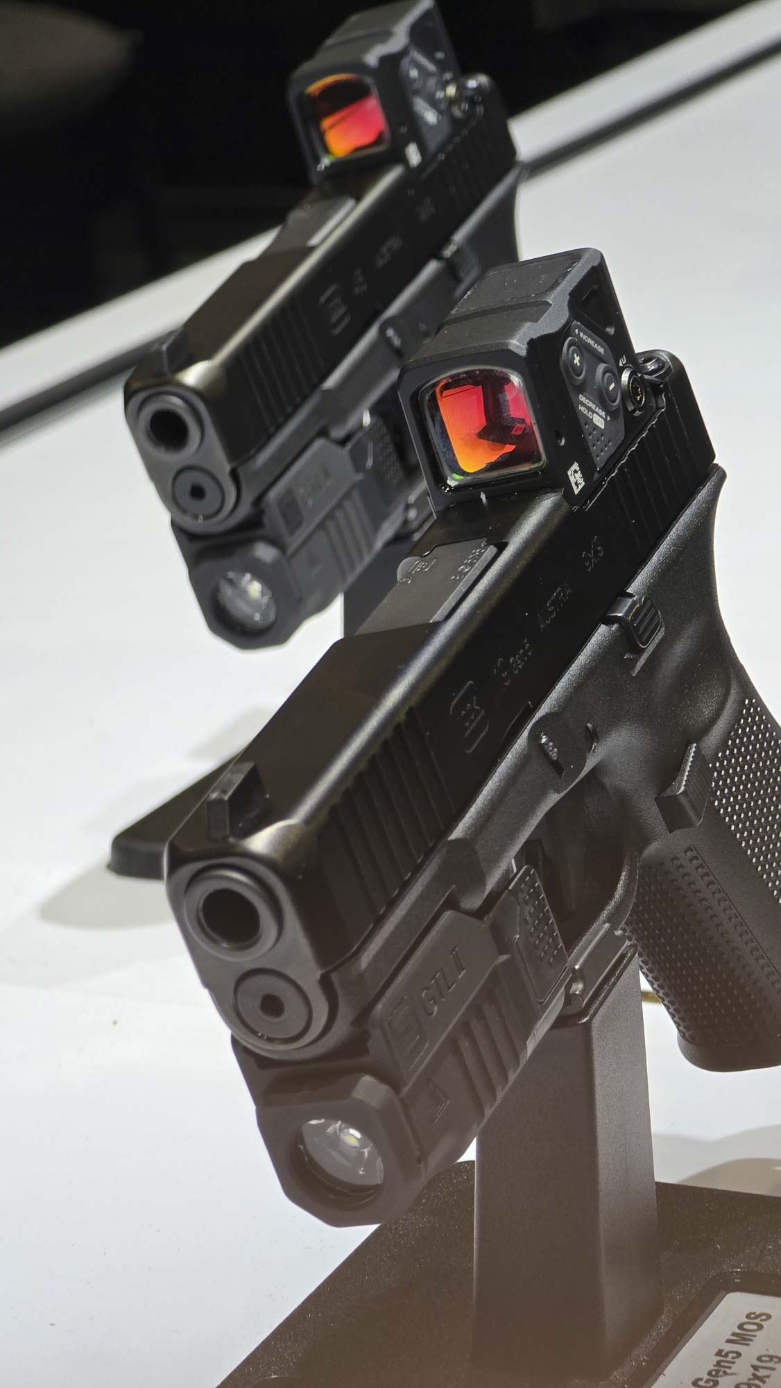 Glock concealed carry pistols with Aimpoint COA red dot sight