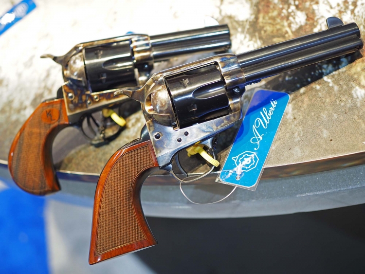 Left to right: the Uberti 1873 Short Stroke revolver designed for Kenda Lenseigne, and a standard 4 3/4" barrel version, as well equipped with a short stroke hammer action