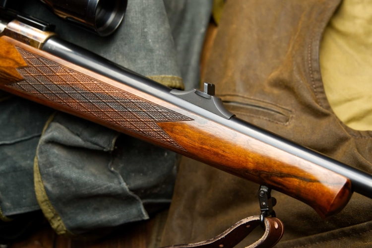 The handguard features a beautiful skip line (or "Scottish") checkering... 