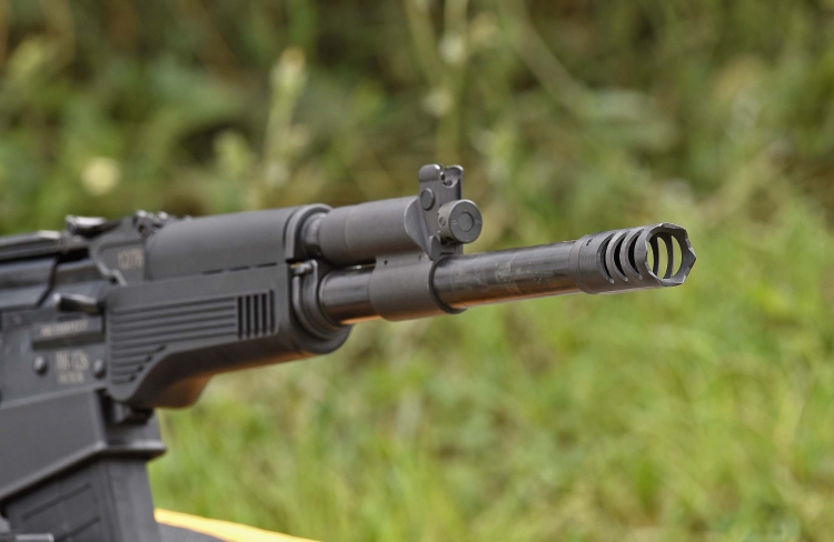 The impressive, "Breacher" style muzzle brake of the S.D.M. AK-12s Tactical shotgun