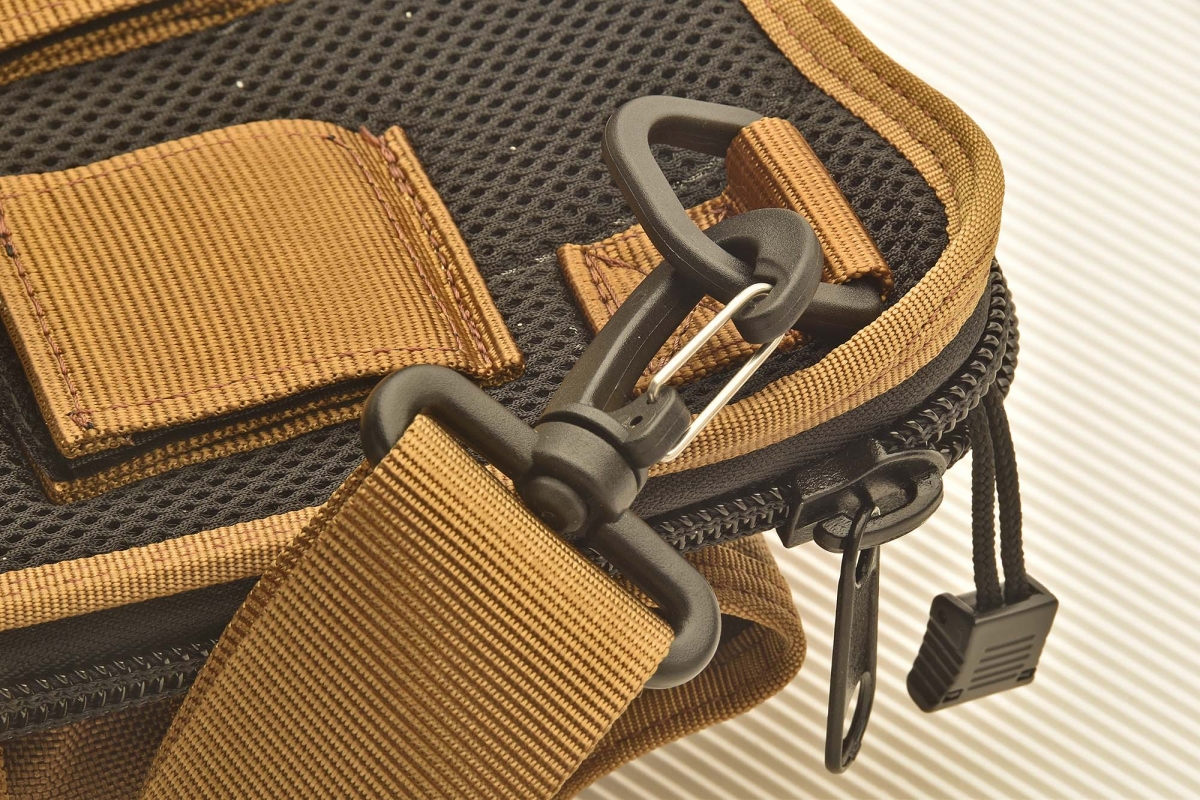 A close-up of the snap-hook that holds the shoulder sling in place