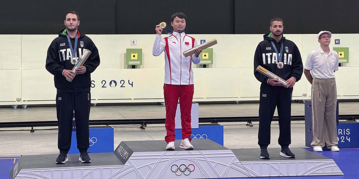 The Men's 10m Air Pistol podium: Xie Yu (PRC, gold); Federico Nilo Maldini (ITA, silver) and Paolo Monna, a Pardini shooter (ITA, bronze)