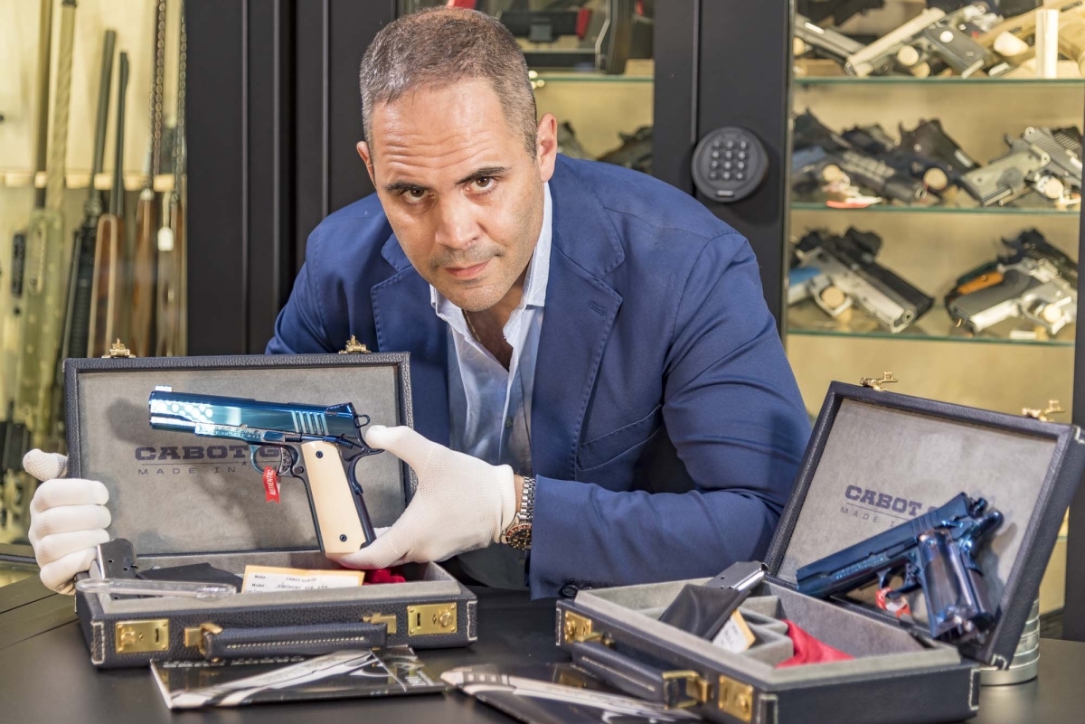 Fabiano Visintini, owner of the Red Point gun shop in Ostia Lido (Roma, Italy) with the two Cabot Guns "Blue Deluxe" that the American company delivered to him exclusively for his shop