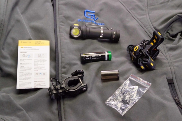 The Armytek Wizard C2 Pro Max with instruction leaflet, head band, included battery, 18650 adapter, spare o-rings and the bracket for mounting on a bycicle