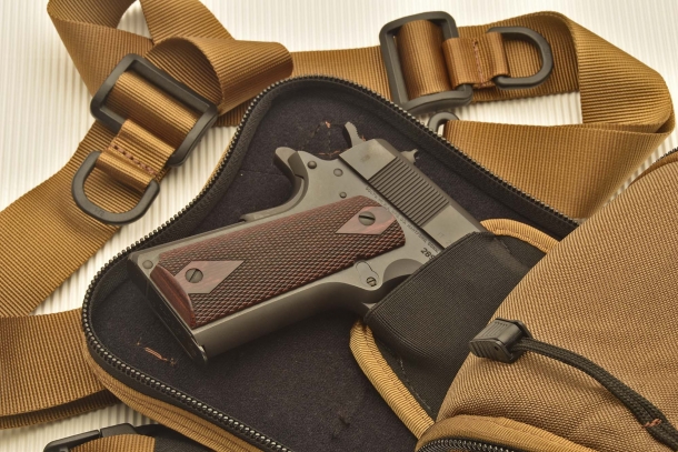 A full-size Colt M1911-A1 pistol in the internal holster