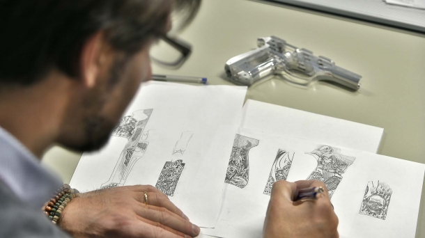 The master engraver prepares the sketches for the engravings