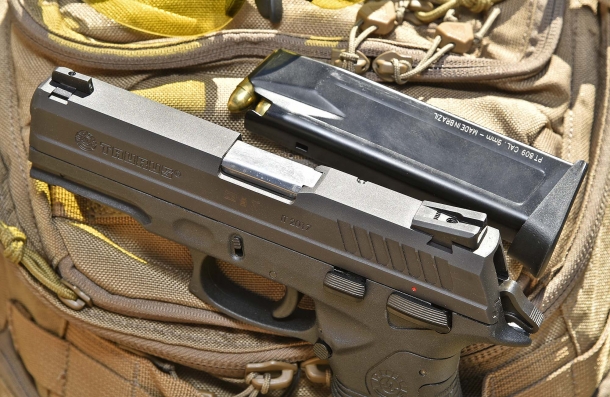 The pistol features Novak sights