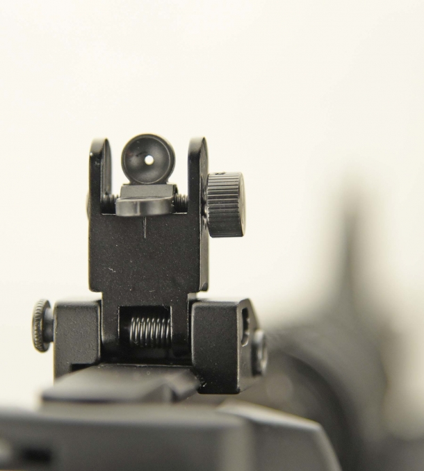 The Colt original flip-up adjustable rear sight (here with the small hole set)