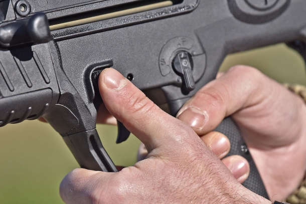 The magazine release button is located just above the trigger guard