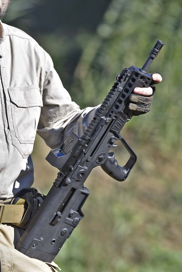 The X95 semi-automatic rifle is extremely compact and a pleasure to shoot; notice the full-length top Picatinny rail