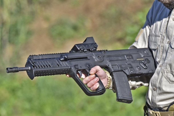 Left side of the X95 rifle: the cocking handle is located just above the pistol grip, and is reversible