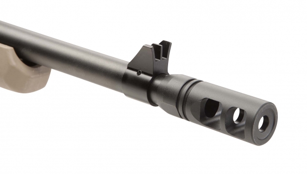 A close-up of the protected, fixed front blade sight; the flash hider is removable from the 5/8x24" threaded muzzle, making the Savage 110 Scout suppressor-ready