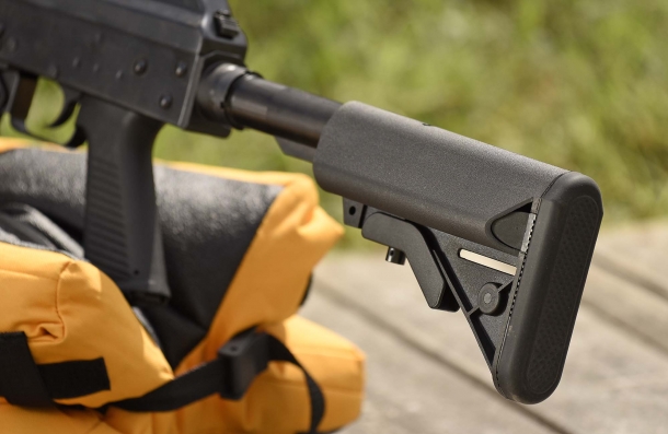 The AR-15 style collapsible stock features a "Crane"-design ambidextrous cheekpiece