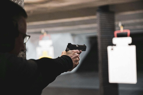 How does real-time firearm detection using existing security cameras actually work?