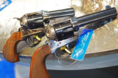 Left to right: the Uberti 1873 Short Stroke revolver designed for Kenda Lenseigne, and a standard 4 3/4" barrel version, as well equipped with a short stroke hammer action