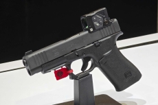 Glock concealed carry pistols with Aimpoint COA red dot sight
